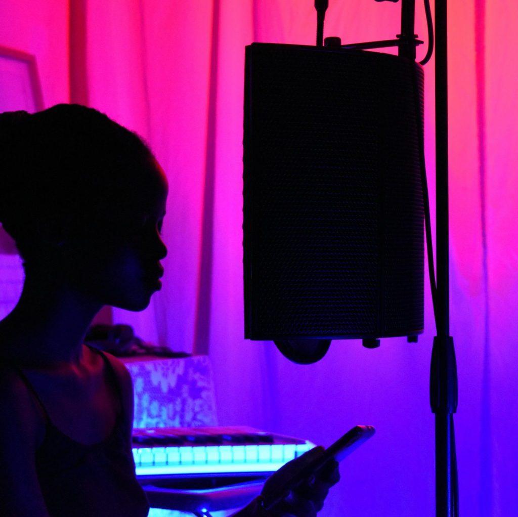 Artist recording vocals at a Bristol recording studio